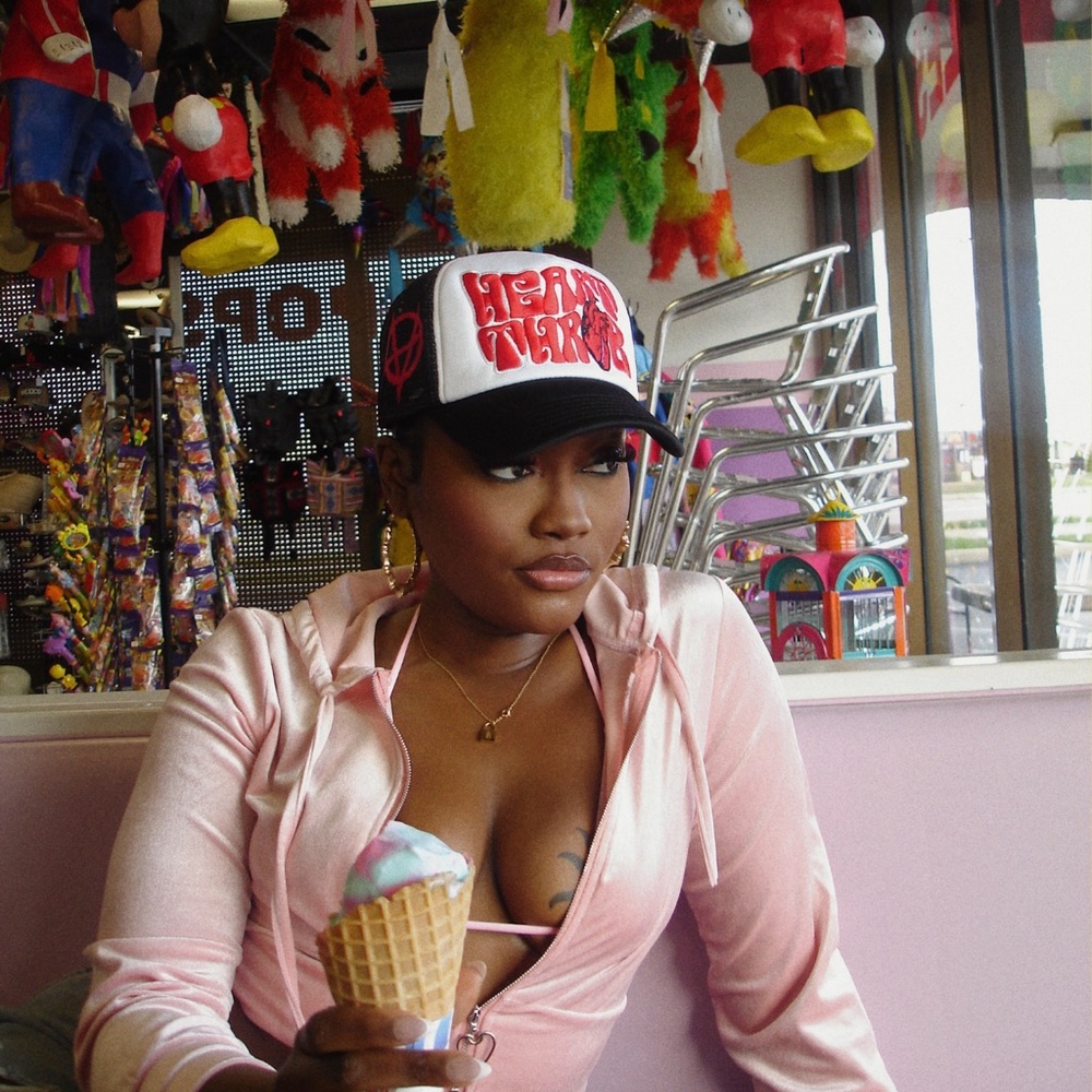 Pink hoodie top! Features heart shape zip up only worn once :)